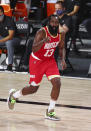 Houston Rockets guard James Harden (13) celebrates after making a three-point basket against the Indiana Pacers in the second half of an NBA basketball game Wednesday, Aug. 12, 2020, in Lake Buena Vista, Fla. (Kim Klement/Pool Photo via AP)