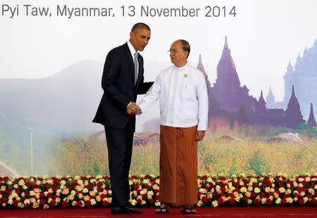 U.S. President Barack Obama (L) and Myanmar's President Thein Sein shake hands before the East Asia Summit (EAS) plenary session during the ASEAN Summit in Naypyitaw November 13, 2014. REUTERS/Soe Zeya Tun