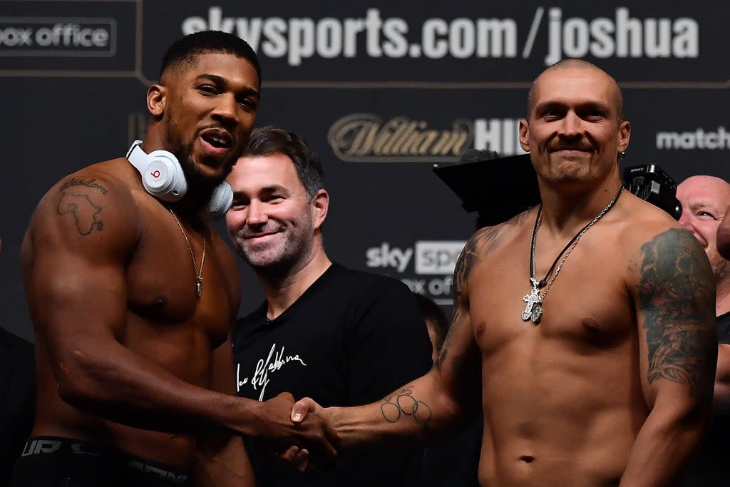 Anthony Joshua and Oleksandr Usyk remained respectful at the weigh-in  (AFP via Getty Images)