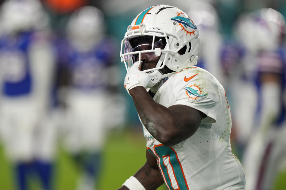 Miami Dolphins wide receiver Tyreek Hill (10) throws kisses to the crowd after scoring a touchdown during the first half of an NFL football game against the Buffalo Bills, Sunday, Jan. 7, 2024, in Miami Gardens, Fla. (AP Photo/Wilfredo Lee)