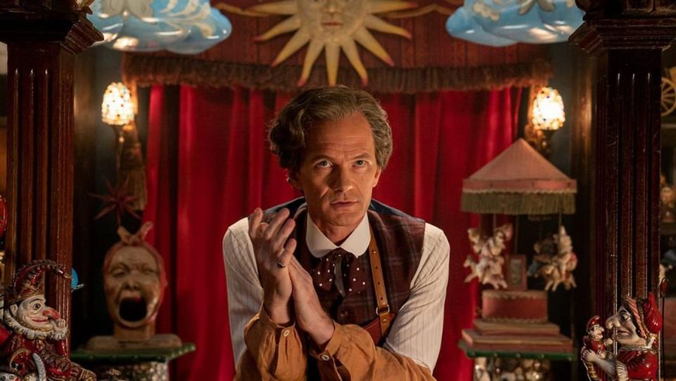 The Toymaker sits in his shop in doctor who anniversary special the giggle