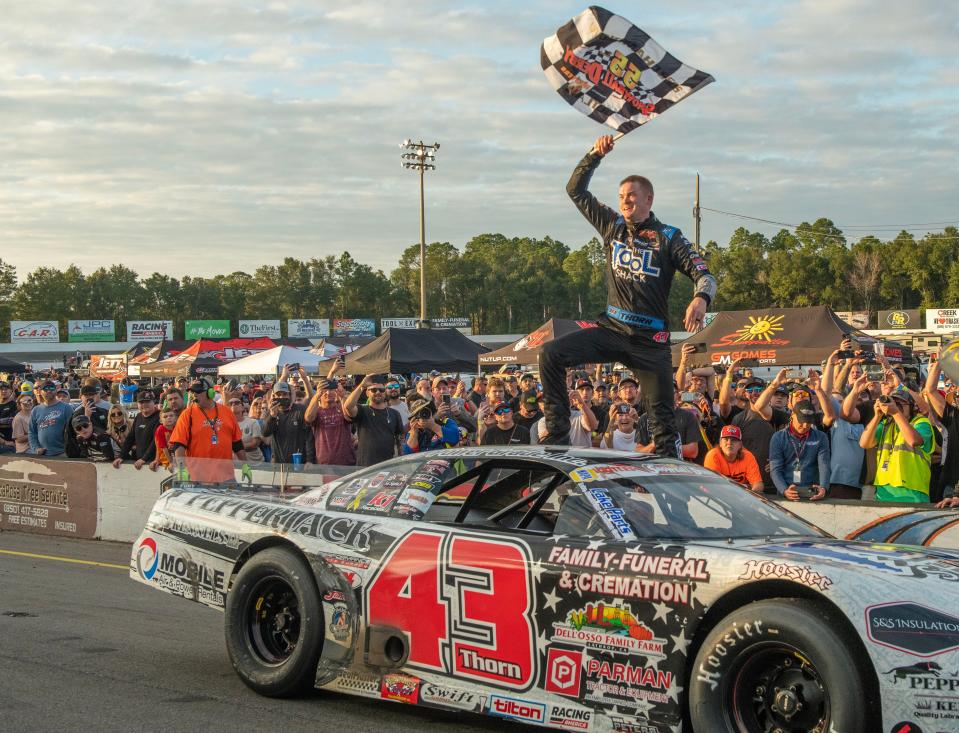 Derek Thorn celebrates after winning the 55th annual Snowball Derby at Five Flags Speedway Sunday, December 4, 2022.