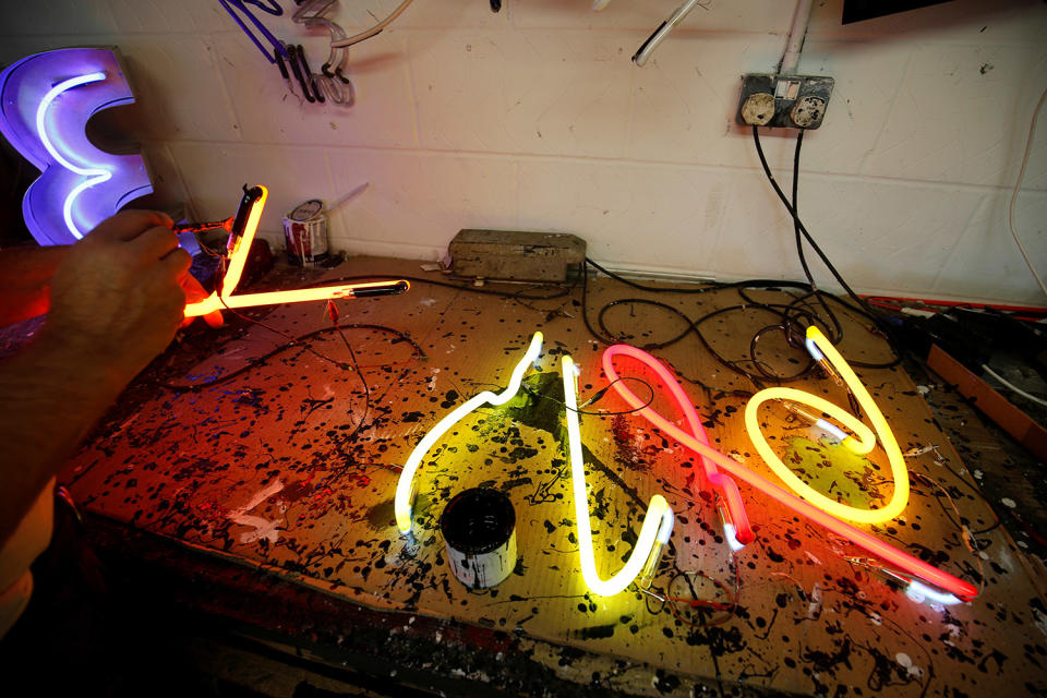 <p>A newly design neon sign artwork is tested for color on a bench in the workshop for God’s Own Junkyard in Rainham, east London, Britain, May 17, 2017. (Photo: Russell Boyce/Reuters) </p>