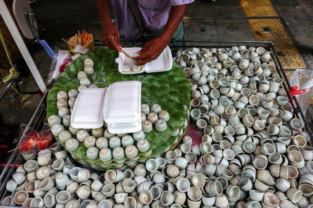 A vendor prepares his deserts at his street food shop in Bangkok, Thailand April 20, 2017. REUTERS/Athit Perawongmetha