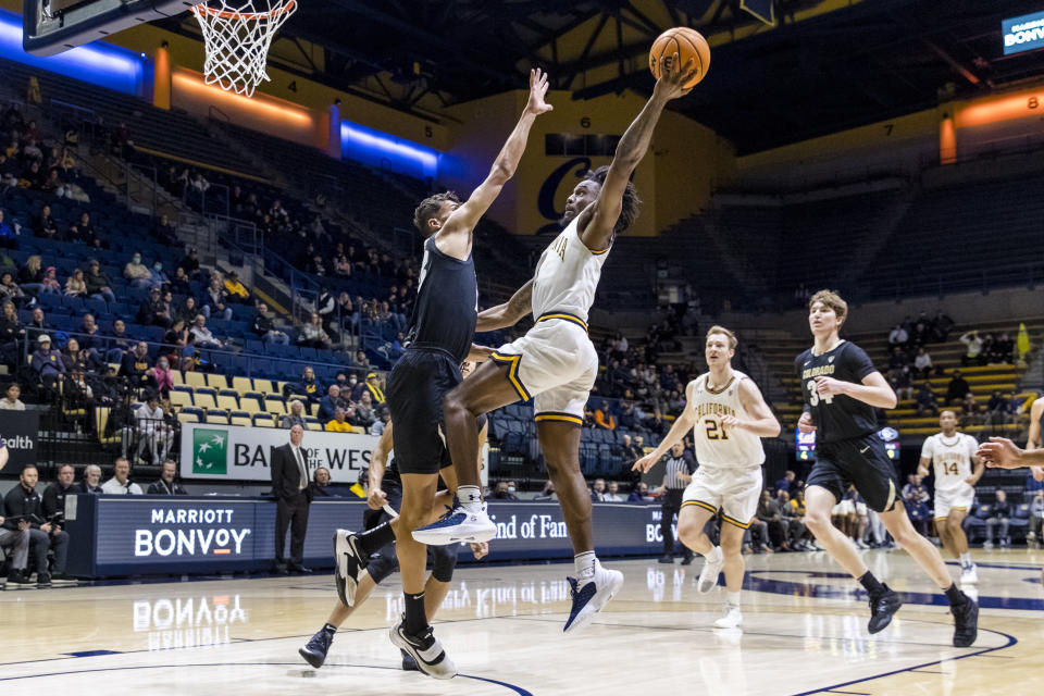 Colorado forward Tristan da Silva, left, defends against a shot by California guard Joel Brown during the first half of an NCAA college basketball game in Berkeley, Calif., Saturday, Dec. 31, 2022. (AP Photo/John Hefti)