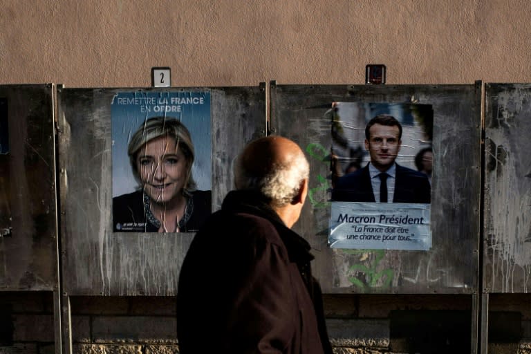 French presidential candidates Emmanuel Macron and Marine Le Pen are at odds on many issues