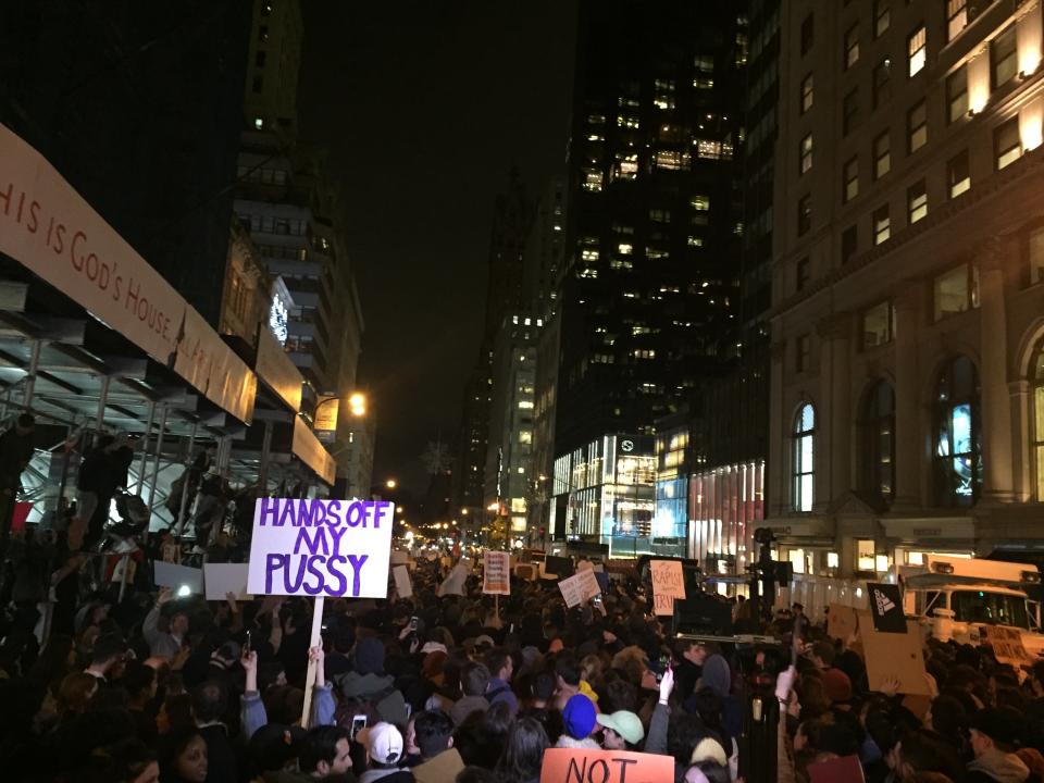 Protesters, many carrying signs, march&nbsp;against President-elect Donald Trump in Manhattan, New York.