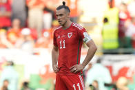 Wales' Gareth Bale reacts after Iran's Ramin Rezaeian scored his side's second goal during the World Cup group B soccer match between Wales and Iran, at the Ahmad Bin Ali Stadium in Al Rayyan , Qatar, Friday, Nov. 25, 2022. (AP Photo/Francisco Seco)