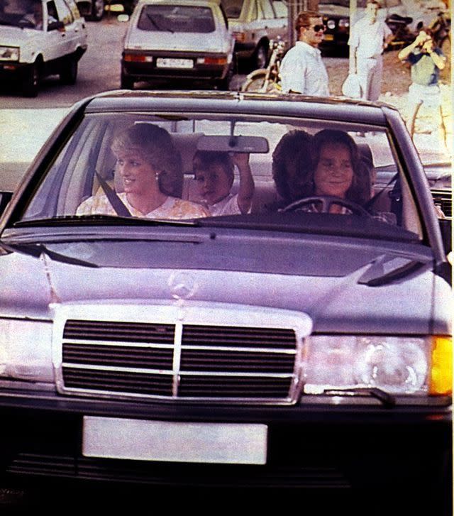 <p>The Princess of Wales rides in the passenger seat of a vintage Mercedes-Benz. </p>