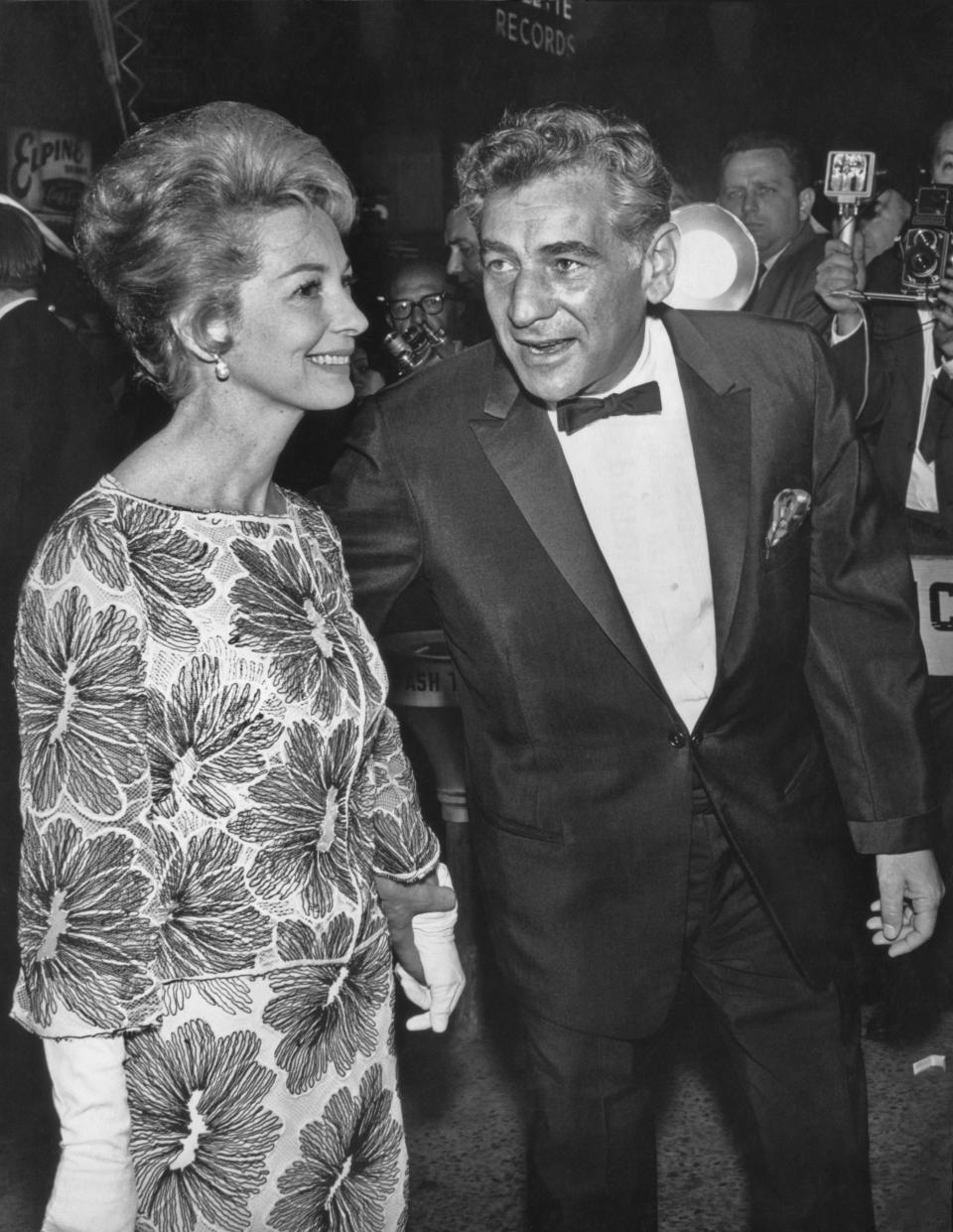 American composer and conductor Leonard Bernstein (1918 - 1990) and his wife actress Felicia Montealegre (1922 - 1978) at the New York film premiere of 'Cleopatra' on June 12, 1963. (Photo by Pictorial Parade/Archive Photos/Getty Images)
