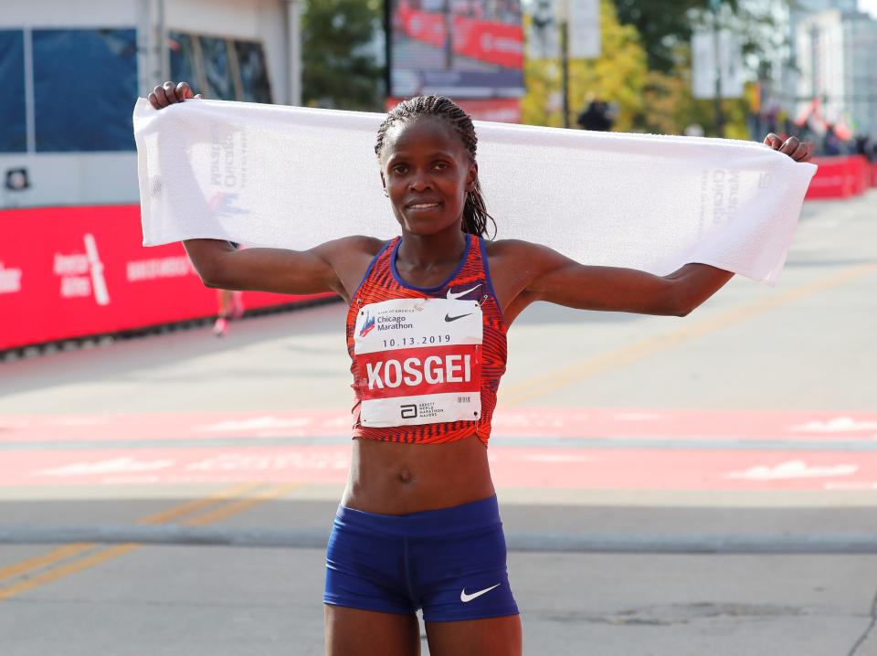 Chicago Marathon - Chicago, Illinois, United States - October 13, 2019.  Kenya's Brigid Kosgei celebrates setting a new world record to win the women's marathon.  REUTERS/Mike Segar