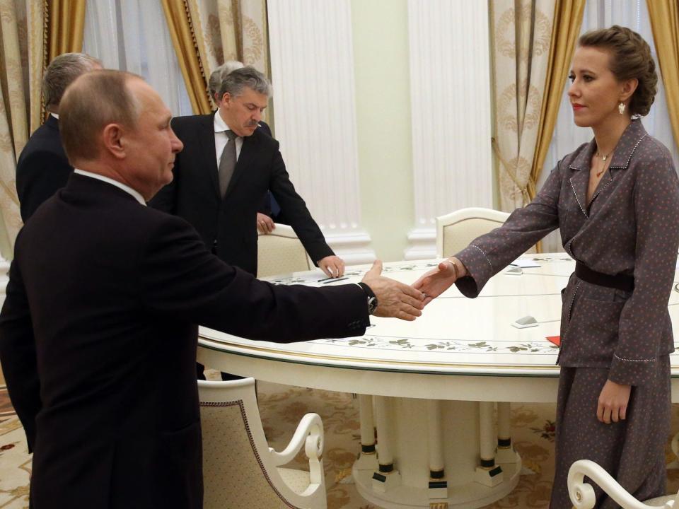 Russian President Vladimir Putin (L) greets liberal opposition candidate Ksenia Sobchak (R) during the meeting at the Kremlin, Russia, March,19,2018