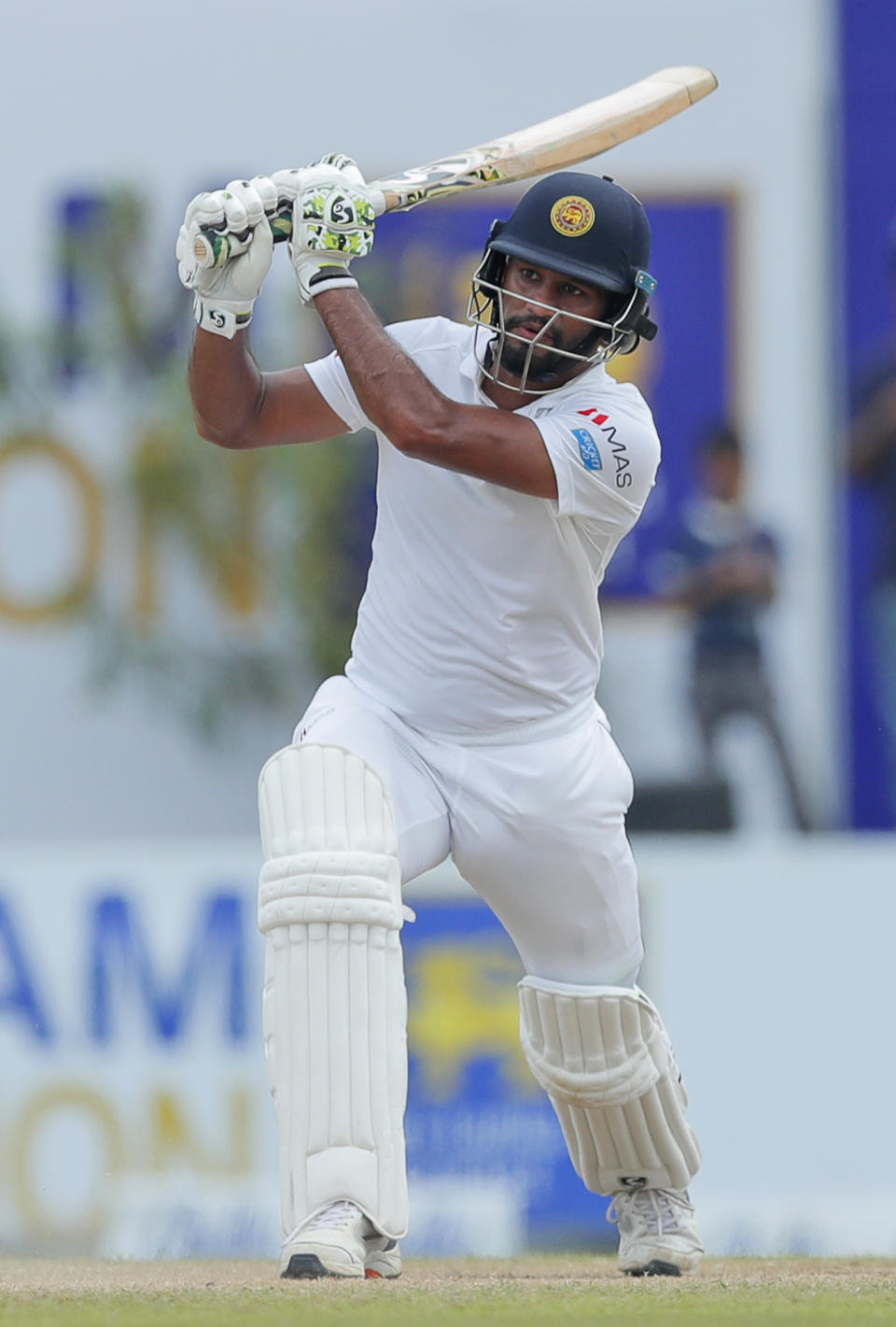 Sri Lanka's Dimuth Karunaratne plays a shot during the fourth day of the first test cricket match between Sri Lanka and New Zealand in Galle, Sri Lanka, Saturday, Aug. 17, 2019. (AP Photo/Eranga Jayawardena)