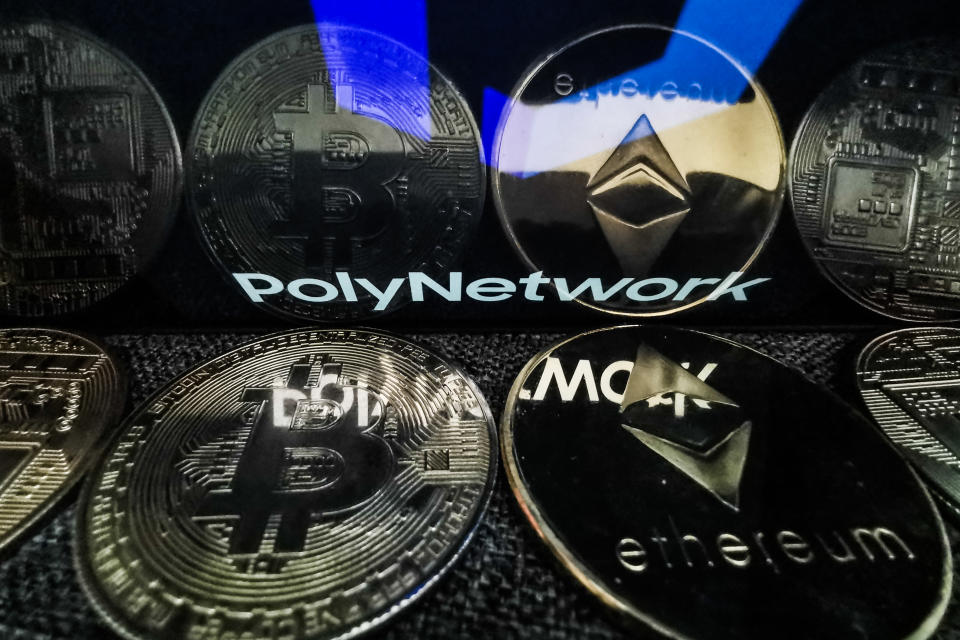 Poly Network logo displayed on a phone screen and representation of cryptocurrencies are seen in this illustration photo taken in Sulkowice, Poland on August 12, 2021. (Photo by Jakub Porzycki/NurPhoto via Getty Images)