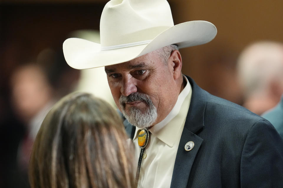 Colorado Rep. Richard Holtorf listens to an attendee before the first Republican primary debate for the 4th Congressional district seat being vacated by Ken Buck Thursday, Jan. 25, 2024, in Fort Lupton, Colo. (AP Photo/David Zalubowski)