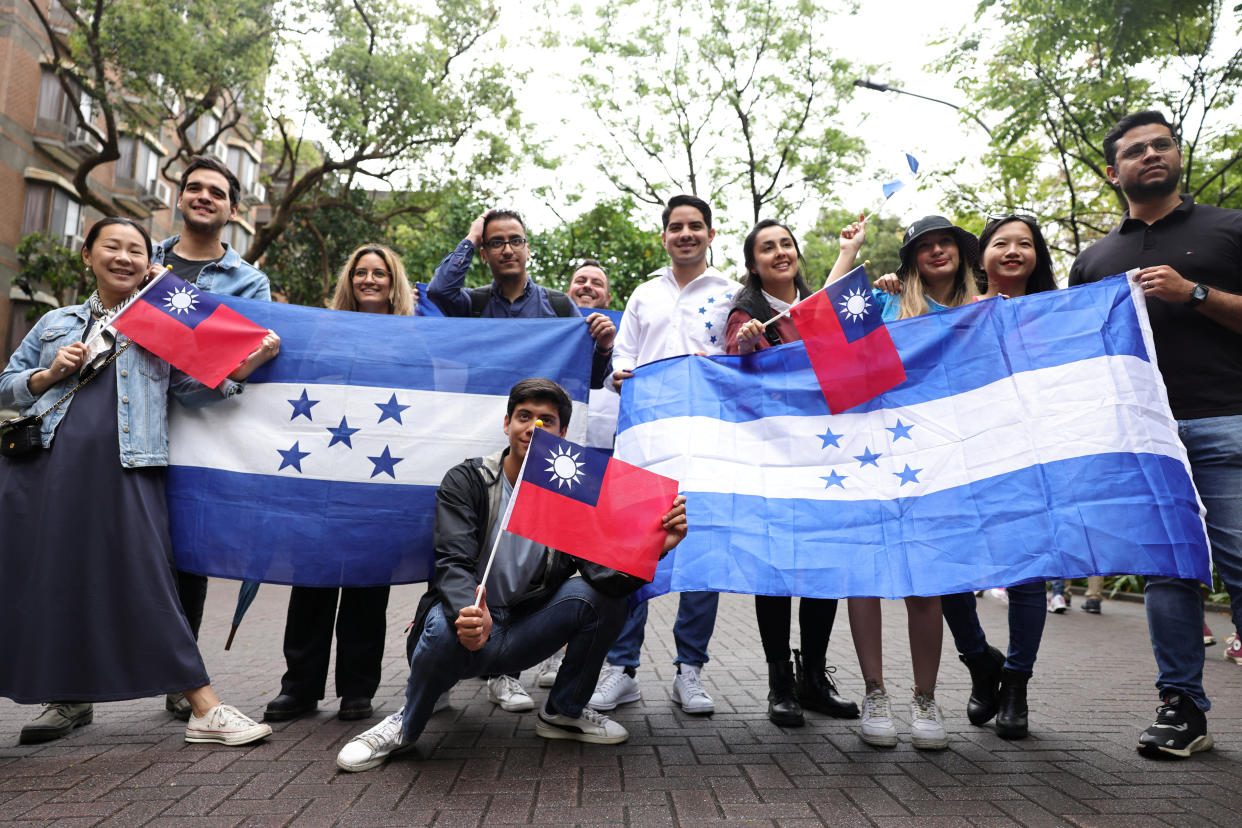 A group of Honduran and Taiwanese pose for pictures during a gathering in support of the relations between Taiwan and Honduras, at National Taiwan University, in Taipei, Taiwan, March 25, 2023. REUTERS/I-Hwa Cheng