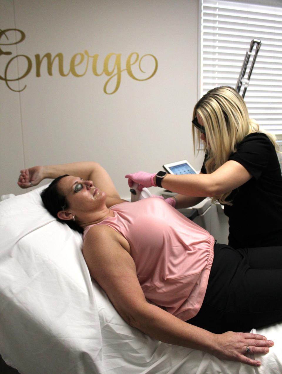 Karen Neely of Westland has an underarm laser hair removal treatment provided by Tiffany Mowinski, lead laser technician at Emerge Medical Spa in Monroe.