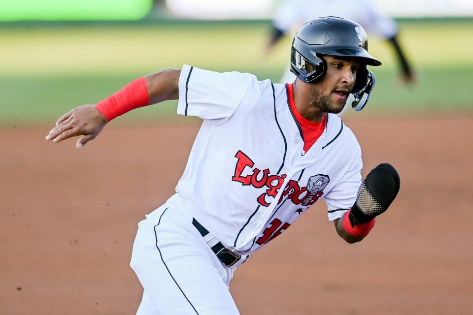 Euribel Angeles of the Lansing Lugnuts scores during the Crosstown Showdown in April 2022. The Lansing Lugnuts will soon be under new ownership after Tom Dickson and Take Me Out to the Ballgame reached an agreement to sell to Diamond Baseball Holdings.