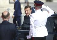 French President Emmanuel Macron is welcomed by Malta Prime Minister Joseph Muscat, left, on the occasion of the Mediterranean Summit of Southern EU countries in Valetta, Malta, Friday, June 14, 2019. (AP Photo/Jonathan Borg)