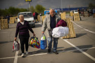 People arrive at a reception center for displaced people in Zaporizhzhia, Ukraine, Monday, May 2, 2022. Thousands of Ukrainian continue to leave Russian occupied areas. (AP Photo/Francisco Seco)