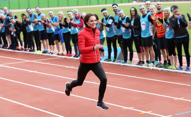 Kate Middleton running in a red jacket