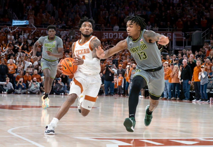 Texas guard Tyrese Hunter (4) drives the ball against Baylor guard Langston Love (13) during the second half of an NCAA college basketball game, Saturday, Jan. 20, 2024, in Austin, Texas. Texas won 75-73. (AP Photo/Michael Thomas)