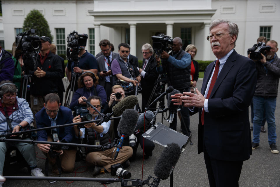 National security adviser John Bolton talks to reporters outside the White House about Venezuela, Wednesday, May 1, 2019, in Washington. (AP Photo/Evan Vucci)