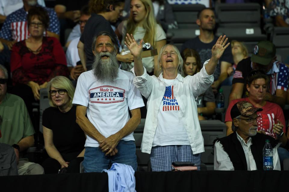 Attendees singing to music before Former President Donald Trump at The Monument in Rapid City, South Dakota on Friday, Sept. 8, 2023.