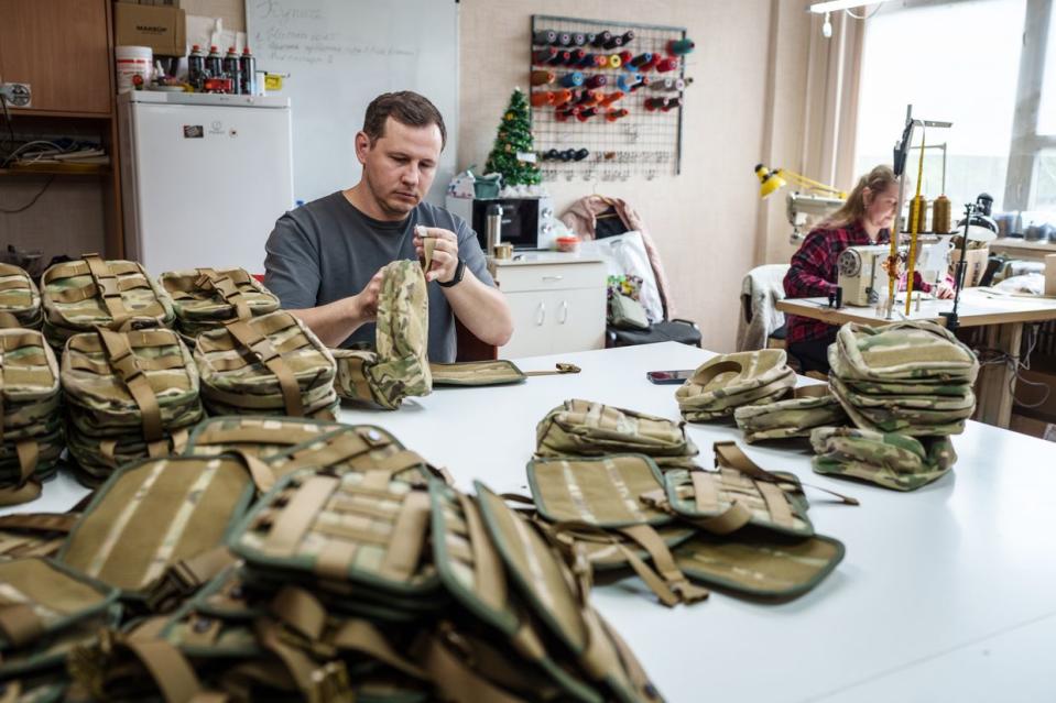 Entrepreneur Yakiv Liashenko checks bags for medical kits that his business produces in Kharkiv, Ukraine, on April 22, 2024. (Serhii Korovayny/The Kyiv Independent)