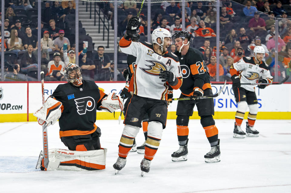 Anaheim Ducks' Adam Henrique, center, reacts to the goal by Frank Vatrano past Philadelphia Flyers' Samuel Ersson, left, during the first period of an NHL hockey game, Saturday, Oct. 28, 2023, in Philadelphia. (AP Photo/Chris Szagola)