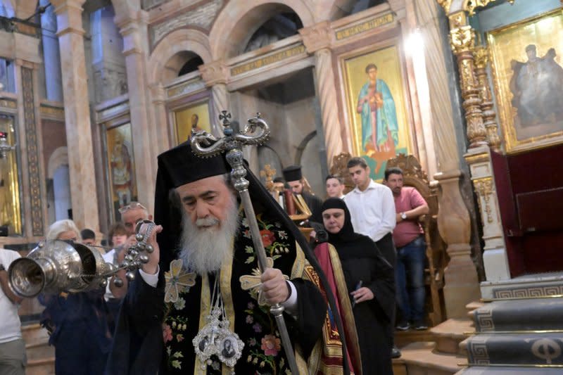 Greek Orthodox Patriarch of Jerusalem Theophilos III leads prayers at a memorial service for the souls of the Gaza war victims and the bombing in Gaza of the Church of Saint Porphyrios, in the Church of the Holy Sepulchre in the Old City of Jerusalem, on Sunday. Photo by Debbie Hill/UPI