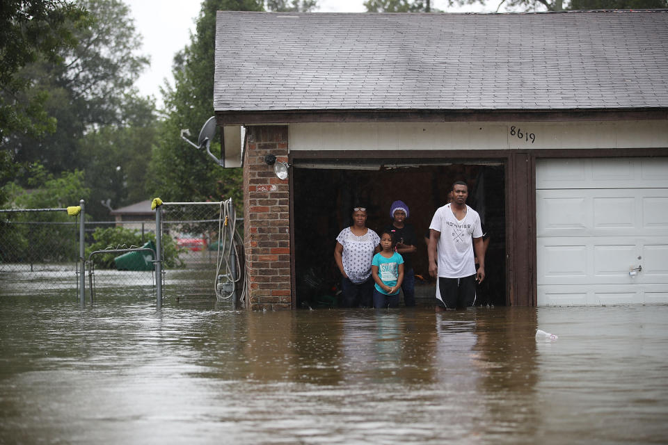 People in Houston wait to be rescued from their flooded homes after the area was inundated by Hurricane Harvey on Aug. 28, 2017. (Photo: Joe Raedle via Getty Images)