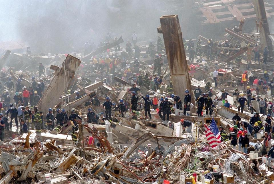 First responders in front of the remains of the World Trade Center in New York City on September 15, 2001, after the September 11 terrorist attacks. In 2024, there are still over 37,000 confirmed 9/11 victims battling cancer and other serious physical and mental illnesses.