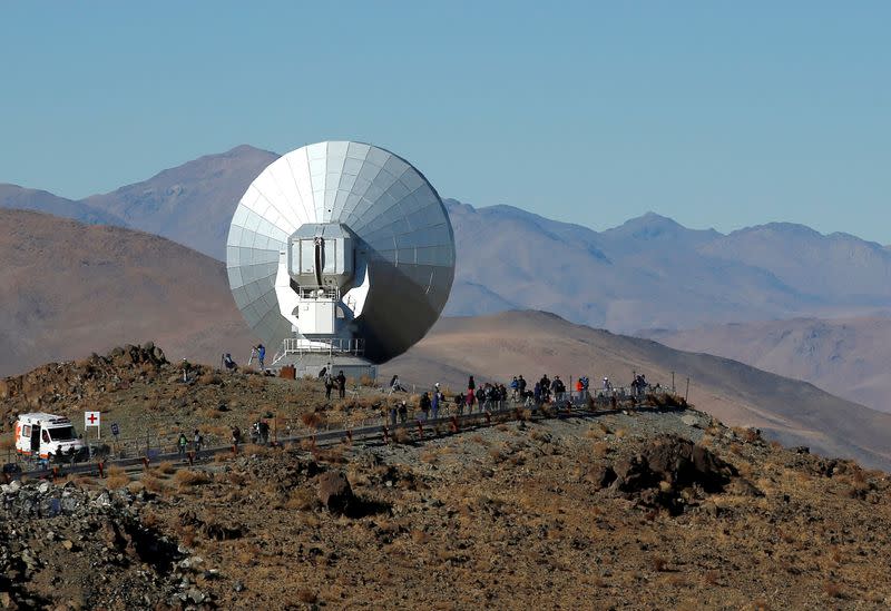 FILE PHOTO: People are seen before of the solar eclipse in La Silla European Southern Observatory (ESO) at Coquimbo