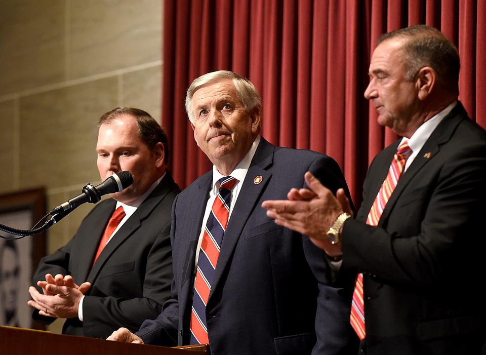 Gov. Mike Parson, center, looks to the gallery after he was introduced by Lt. Gov. Mike Kehoe, right, and Speaker of the House Rob Vescovo on Wednesday before Parson delivered the State of the State address in the House chamber of the Missouri Capitol in Jefferson City.