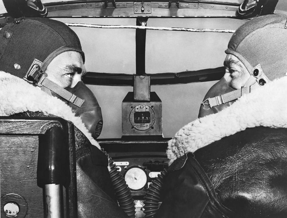Two aviation cadets from Brooks Field wearing oxygen masks as they pilot a B-25 bomber on a routine high altitude training mission, Fort Worth, Texas, June 1944. | Getty Images