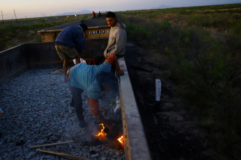 The Wider Image: Migrants risk life and limb to jump Mexico trains in rush to border