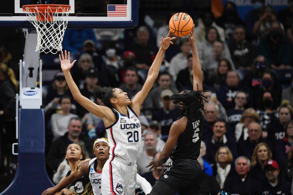 UConn's Olivia Nelson-Ododa looks to block a shot from UCF's Masseny Kaba.