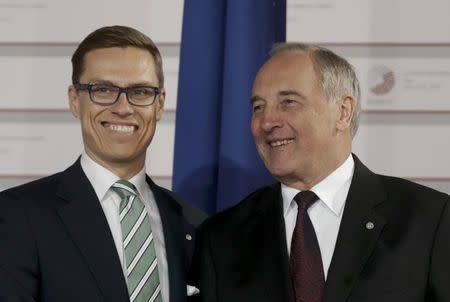 Latvian President Andris Berzins welcomes Finnish Prime Minister Alexander Stubb (L) at the Eastern Partnership Summit in Riga, Latvia, May 21, 2015. REUTERS/Ints Kalnins