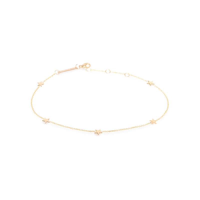 <a rel="nofollow noopener" href="https://zoechicco.com/products/14k-five-itty-bitty-stars-anklet" target="_blank" data-ylk="slk:14K Five Itty Bitty Stars Anklet, Zoe Chicco, $350;elm:context_link;itc:0;sec:content-canvas" class="link ">14K Five Itty Bitty Stars Anklet, Zoe Chicco, $350</a>