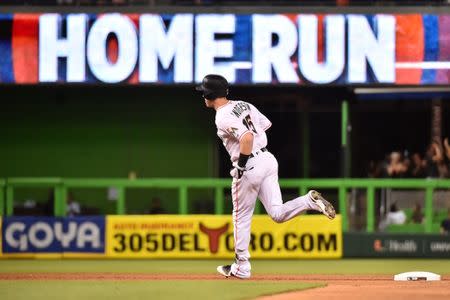 Jul 9, 2018; Miami, FL, USA; Miami Marlins right fielder Brian Anderson (15) rounds the bases after hitting a solo home run in the seventh inning against the Milwaukee Brewers at Marlins Park. Mandatory Credit: Jasen Vinlove-USA TODAY Sports