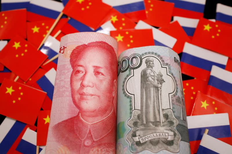 Illustration picture of China's yuan and Russia's rouble banknotes