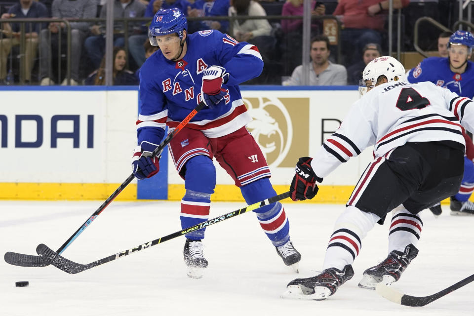 New York Rangers center Ryan Strome (16) skates against Chicago Blackhawks defenseman Seth Jones (4) during the first period of an NHL hockey game Saturday, Dec. 4, 2021, at Madison Square Garden in New York. (AP Photo/Mary Altaffer)