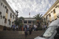 Lawyers and relatives walk outside the court where journalist Hajar Rissouni is being tried on accusations of undergoing an illegal abortion, in Rabat, Morocco, Monday, Sept. 30, 2019. The 28-year old Moroccan journalist Hajar Raissouni was sentenced to one year in prison, Monday, while her fiancé also received a one-year sentence and the doctor accused of terminating the pregnancy was sentenced to two years in jail and suspended from practicing. (AP Photo/Mosa'ab Elshamy)