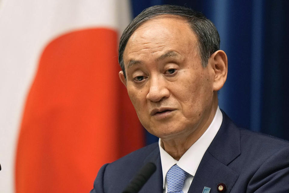 FILE - In this Aug. 17, 2021, file photo, Japanese Prime Minister Yoshihide Suga speaks during a news conference at prime minister's official residence in Tokyo. Broadcaster NHK says Friday, Sept. 3, 2021, Suga won't run for party leader, hinting he will resign as Japanese leader at the end of September. (Kimimasa Mayama/Pool Photo via AP, File)