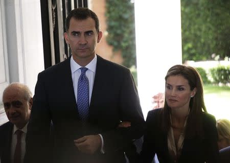 Spain's new King Felipe (L) and Queen Letizia arrive for an event to show support for victims of terrorism in Madrid June 21, 2014. REUTERS/Andrea Comas