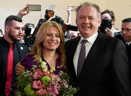 Slovakia's President Andrej Kiska poses with presidential candidate Zuzana Caputova at her party's headquarters in Bratislava, Slovakia, March 30, 2019. REUTERS/David W Cerny