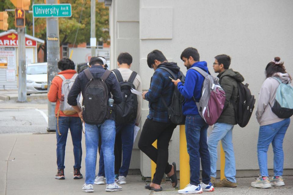 A line up of people waited for a job interview recently at a downtown LCBO. Two of the people who waited in line told CBC they are international students looking for jobs. 