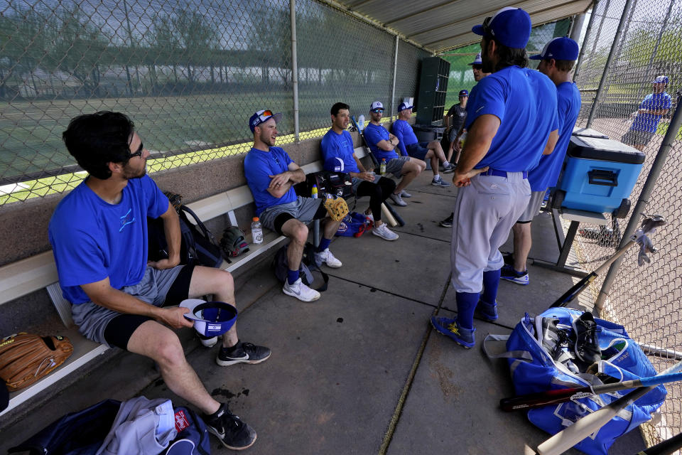 Israel Olympic baseball players take a break in the dugout during practice at Salt River Fields spring training facility, Wednesday, May 12, 2021, in Scottsdale, Ariz. Israel has qualified for the six-team baseball tournament at the Tokyo Olympic games which will be its first appearance at the Olympics in any team sport since 1976. (AP Photo/Matt York)