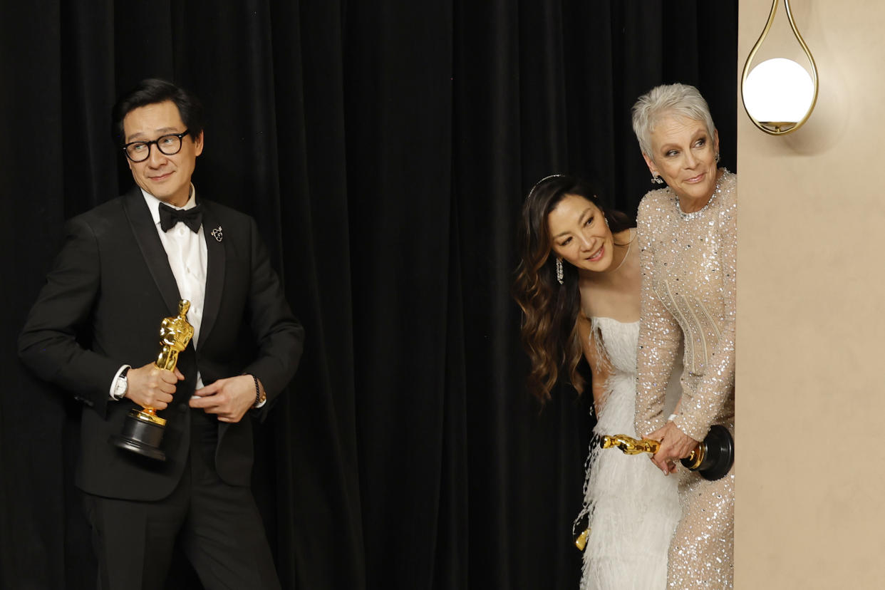 Ke Huy Quan, Michelle Yeoh, and Jamie Lee Curtis, at the Oscars 2023. (Mike Coppola/Getty Images)